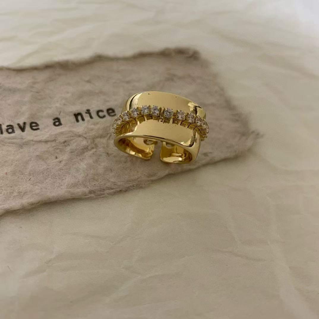 Wide-Band Ring with a Row of Clear Stones